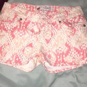 jean shorts with pink and white print